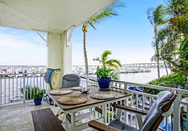 balcony featuring a water view