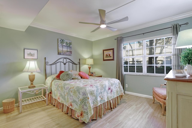 bedroom with ceiling fan, light hardwood / wood-style floors, and ornamental molding