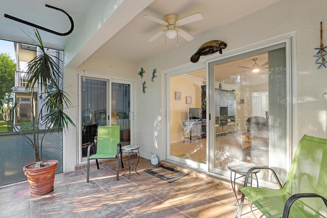 sunroom / solarium with ceiling fan