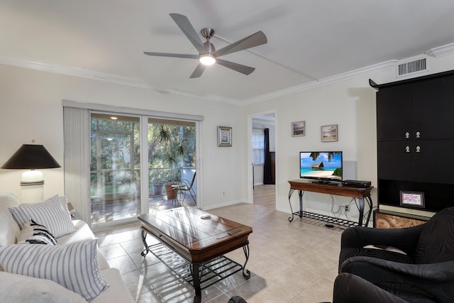 living room featuring light tile patterned floors, ceiling fan, and crown molding