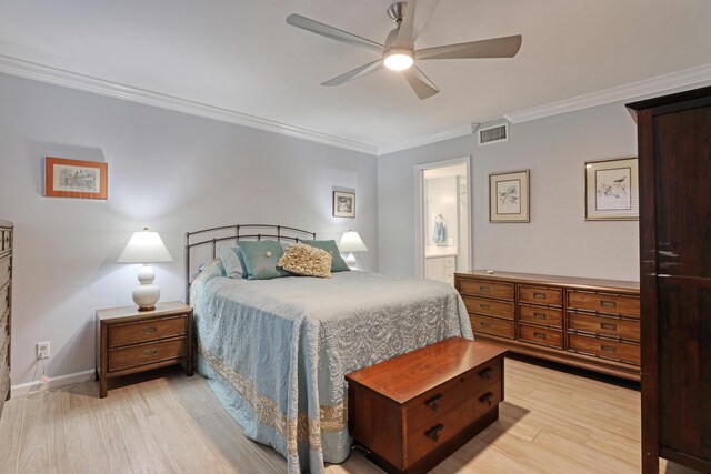 bedroom with light hardwood / wood-style flooring, ensuite bath, ceiling fan, and ornamental molding