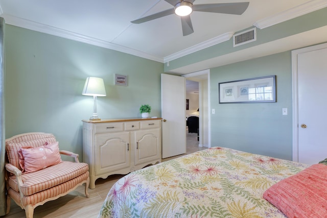 bedroom with ceiling fan, light hardwood / wood-style flooring, and ornamental molding