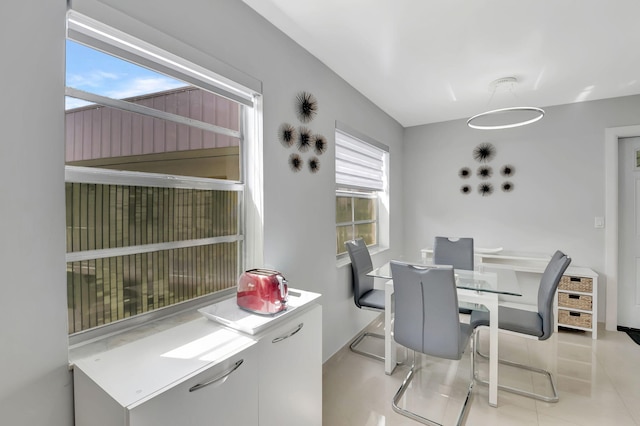 dining space with light tile patterned floors