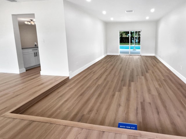 unfurnished living room with light hardwood / wood-style flooring