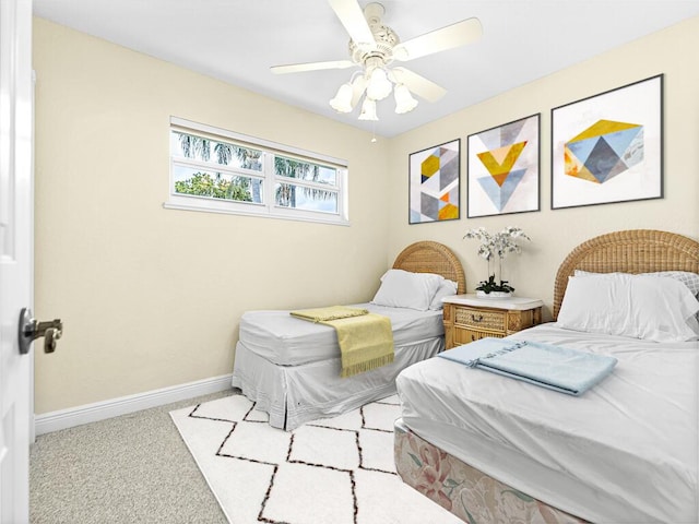 bedroom with ceiling fan and light carpet