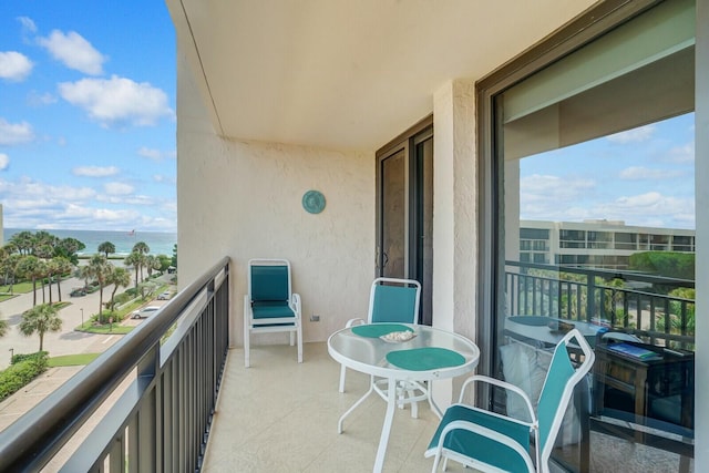 balcony featuring a water view