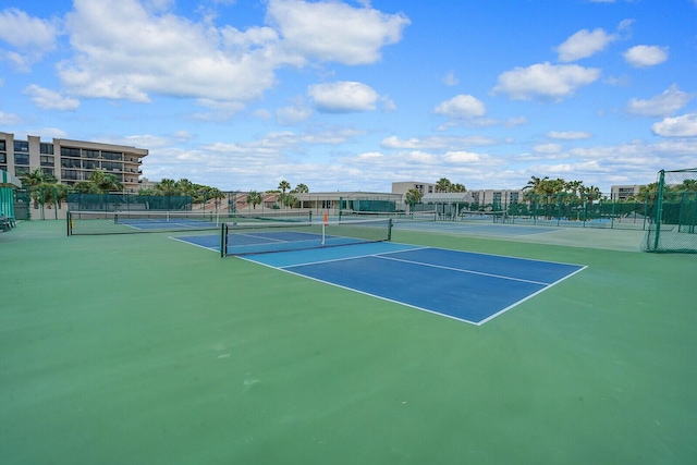 view of tennis court featuring basketball court