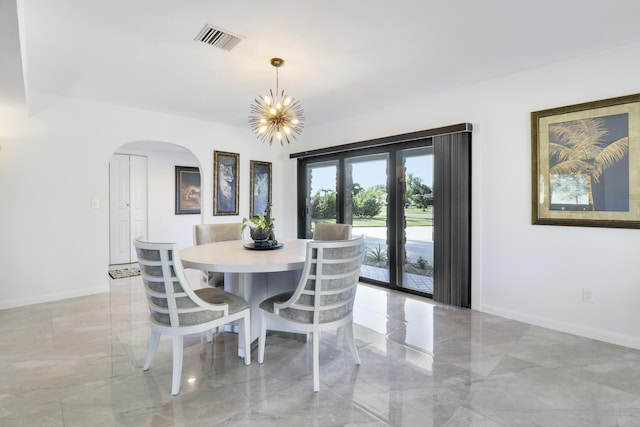 dining area featuring a chandelier