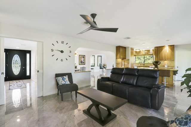 living room featuring ceiling fan