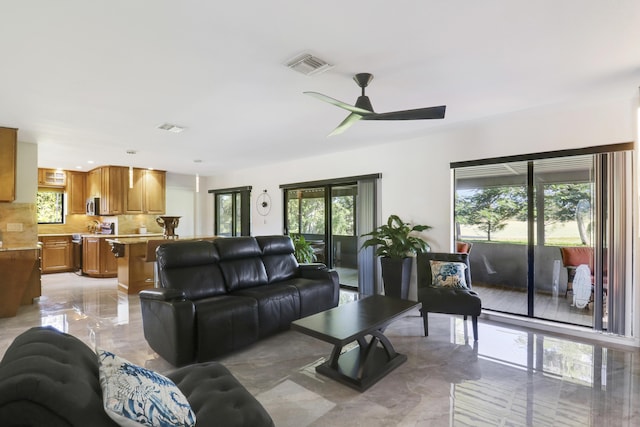 living room featuring ceiling fan