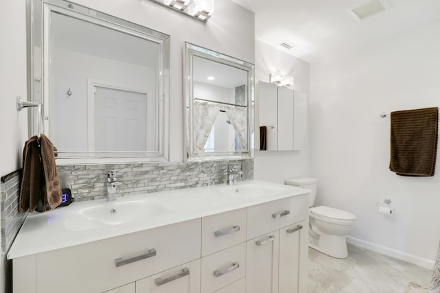 bathroom with decorative backsplash, tile patterned floors, walk in shower, vanity, and toilet