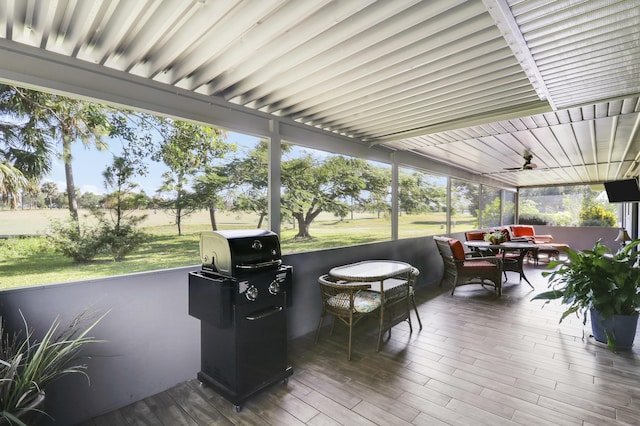 deck featuring a lawn and a grill