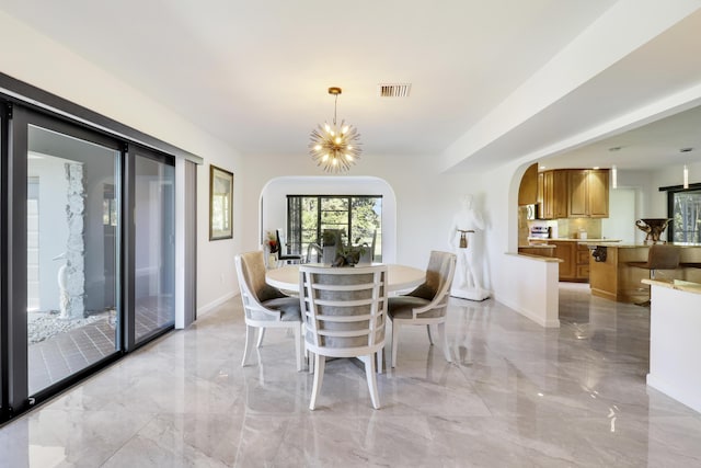 dining room featuring a notable chandelier