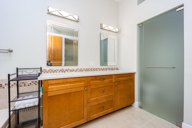 bathroom with tile patterned flooring and vanity