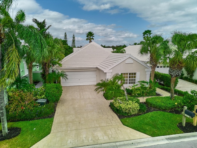 view of front of property with a garage