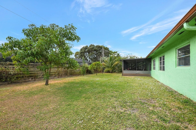 view of yard featuring a sunroom