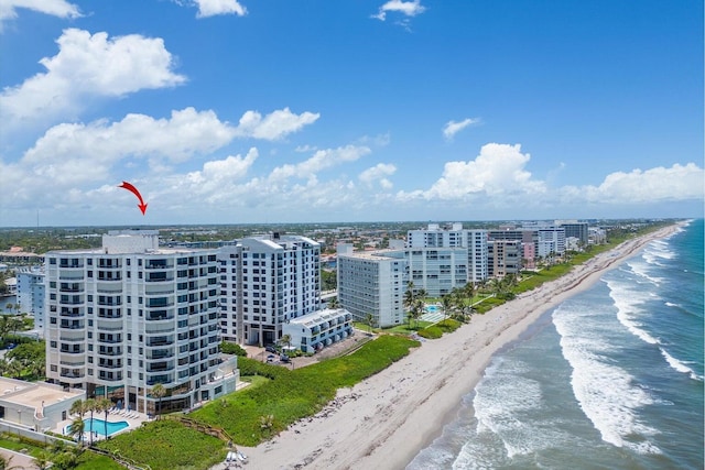 bird's eye view featuring a view of the beach and a water view