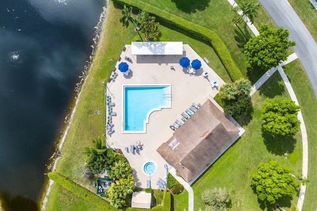 birds eye view of property with a water view