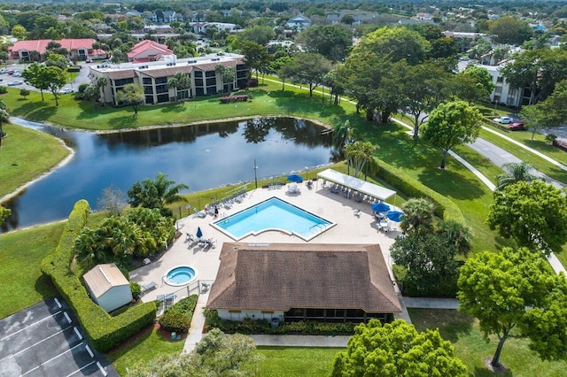 birds eye view of property with a water view