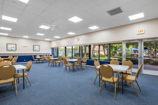 dining area with carpet flooring and ceiling fan