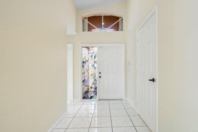 tiled entryway with high vaulted ceiling