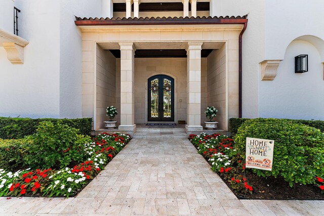 view of patio featuring a swimming pool with hot tub and french doors