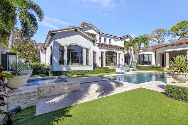 rear view of house featuring a patio area