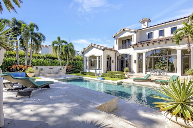 view of swimming pool featuring a patio area