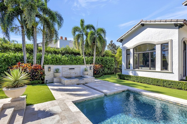 view of swimming pool featuring a patio