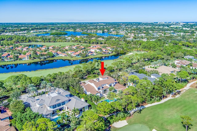 birds eye view of property with a water view