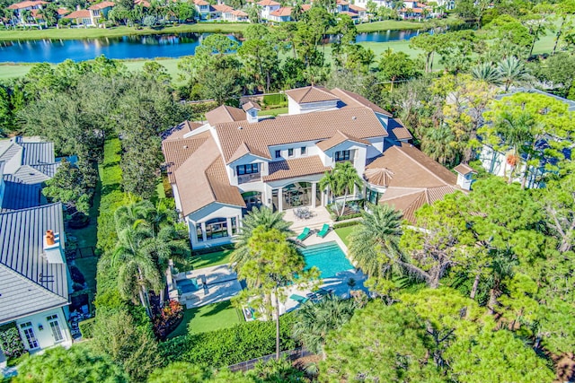 birds eye view of property with a water view