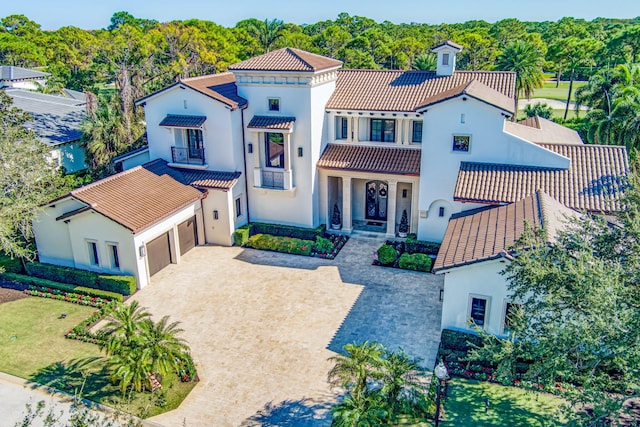 mediterranean / spanish house featuring a front yard