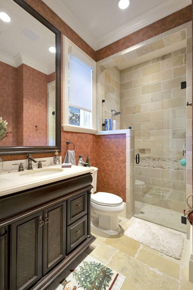 bathroom featuring toilet, vanity, an enclosed shower, and ornamental molding