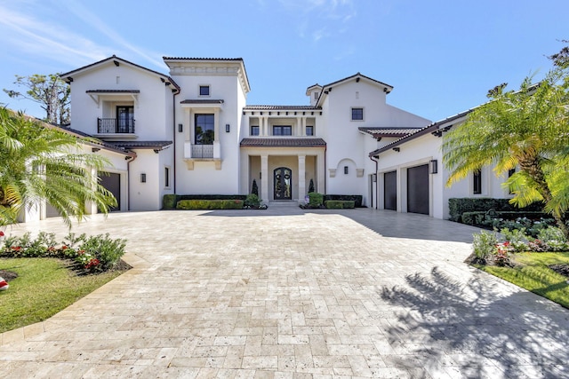 mediterranean / spanish-style home featuring a balcony