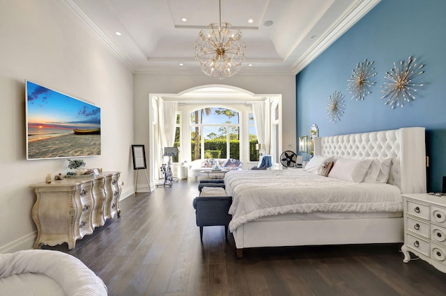 bedroom with dark hardwood / wood-style floors, crown molding, a tray ceiling, and a notable chandelier