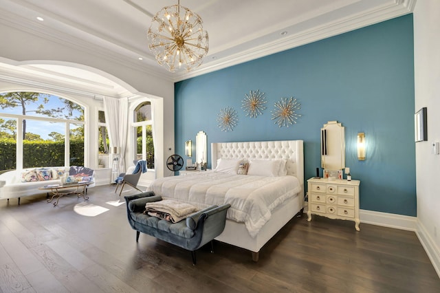 bedroom with dark hardwood / wood-style flooring, an inviting chandelier, and ornamental molding