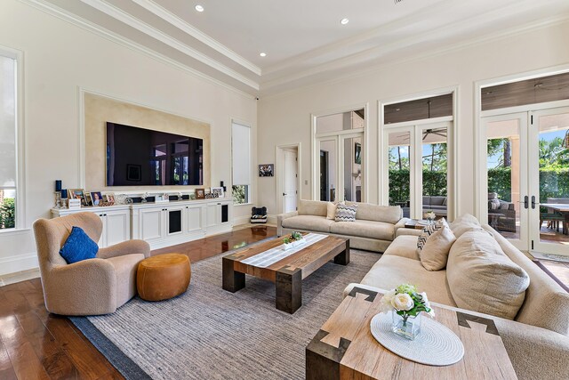 bathroom with a bathing tub, vanity, high vaulted ceiling, and an inviting chandelier