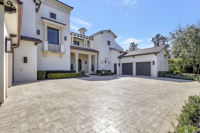 mediterranean / spanish-style home with a balcony