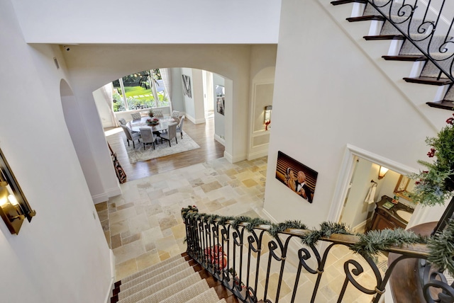 staircase with hardwood / wood-style flooring