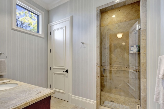 bathroom featuring vanity, an enclosed shower, and ornamental molding