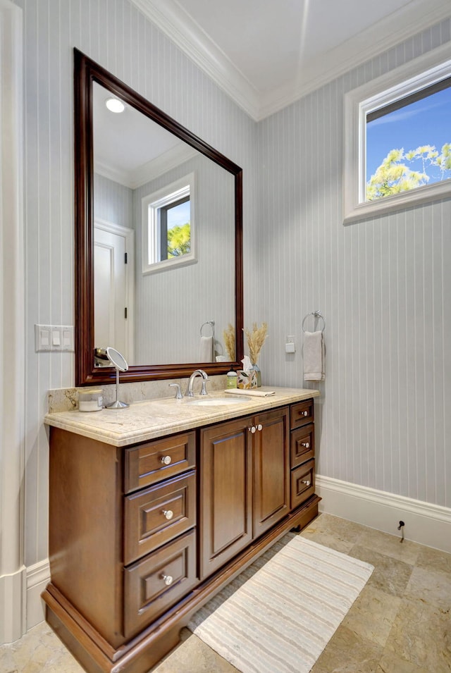 bathroom with vanity and ornamental molding