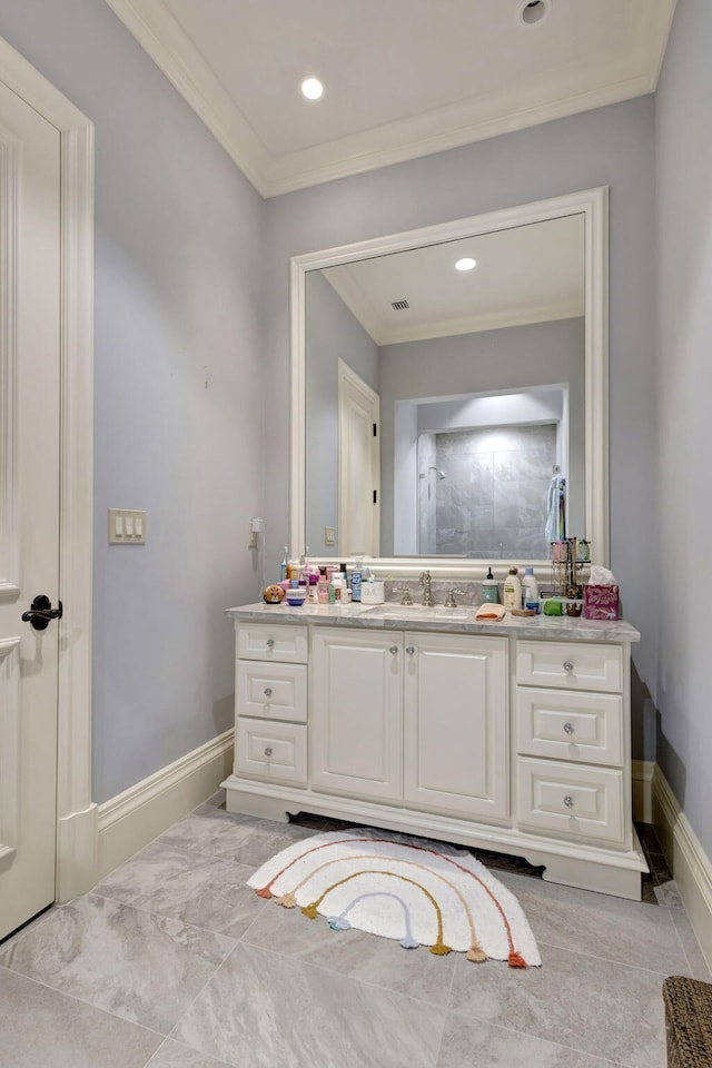 bathroom with vanity and ornamental molding