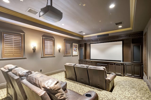 carpeted cinema room with ornamental molding