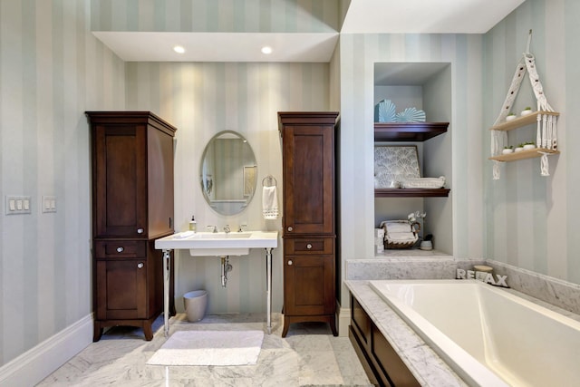 bathroom with a tub and sink