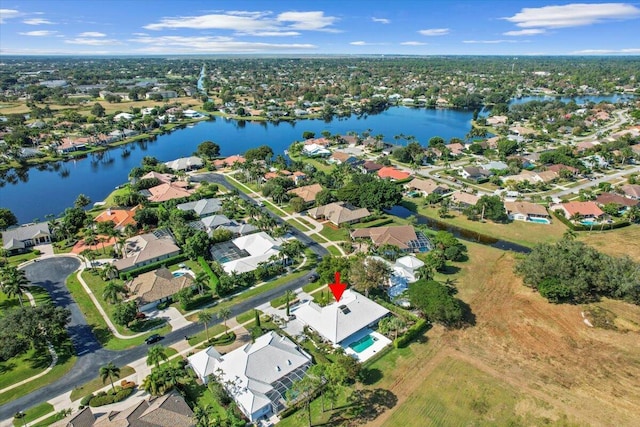 birds eye view of property with a water view