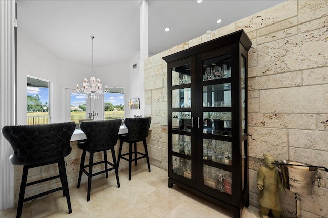 dining room with french doors and a notable chandelier