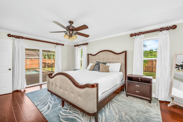 bedroom featuring ceiling fan, dark wood-type flooring, access to outside, and ornamental molding