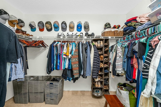 walk in closet featuring tile patterned flooring