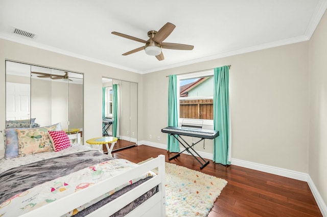 bedroom with dark wood-type flooring, ceiling fan, and crown molding