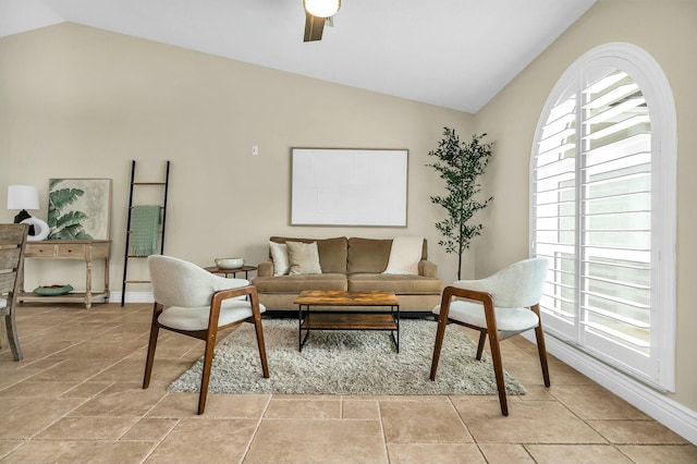 living room with ceiling fan and vaulted ceiling